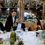 Tavolata allestita per una cena aziendale di Natale presso il ristorante Il Piccolo Mondo Redoro a Peschiera del Garda.